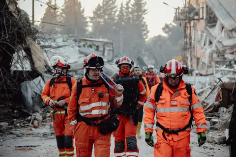 Rescue workers in orange uniforms